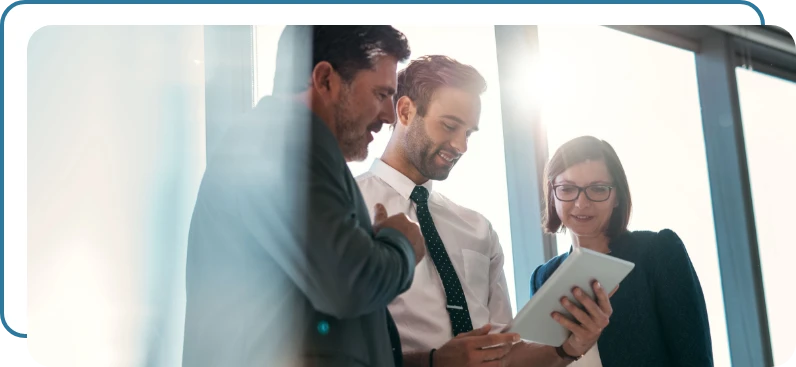 Three business people discussing a proposal