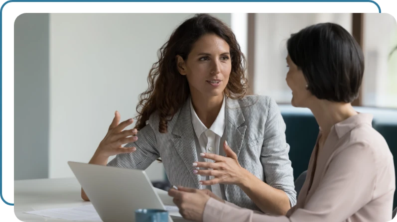 two business women collaborating on a task